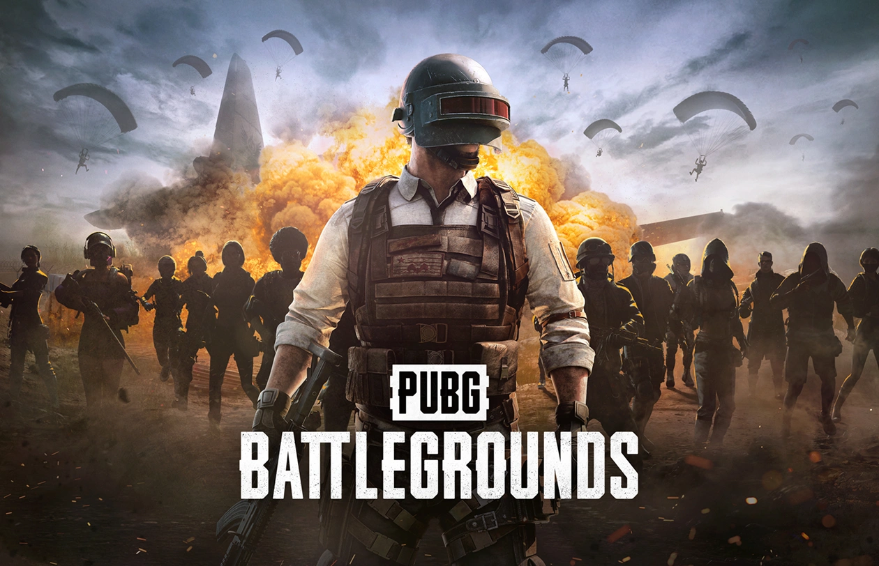 Gracz PUBG na tle eksplozji i spadochroniarzy